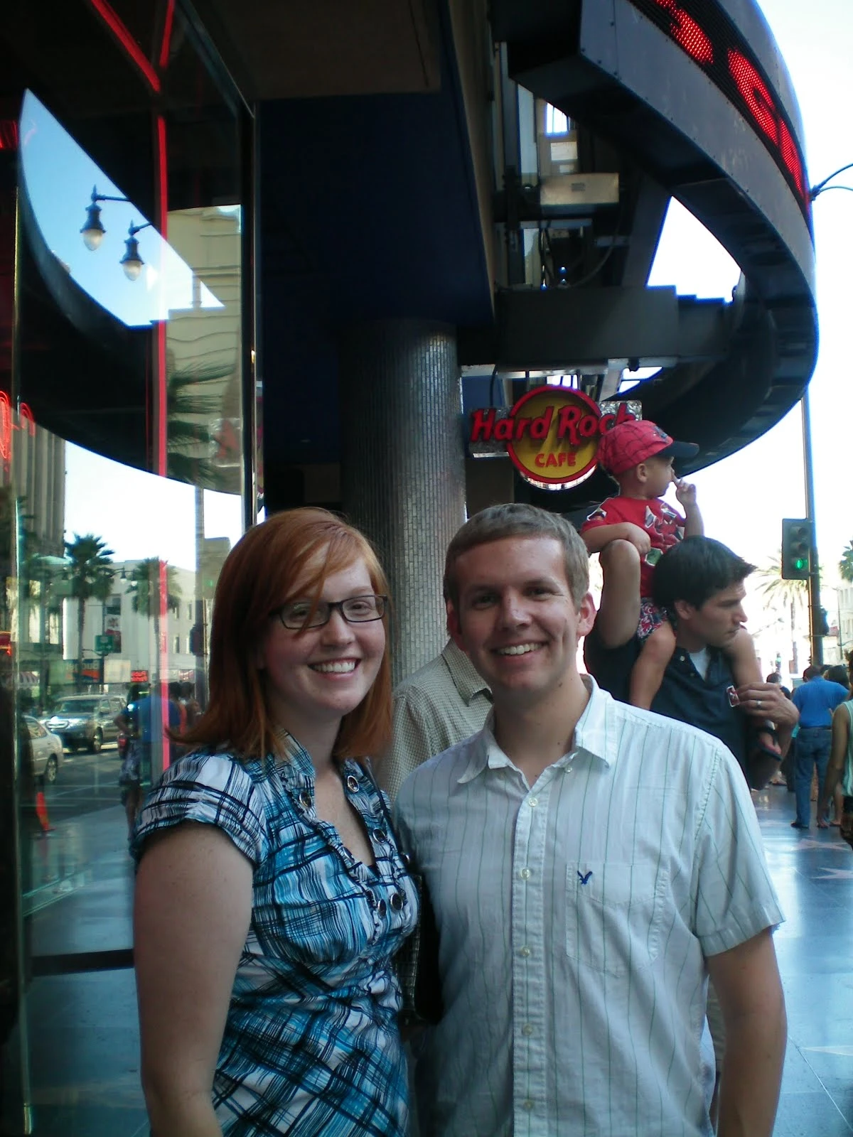Danielle and Jon smiling together outside the Hard Rock Cafe on Hollywood Boulevard